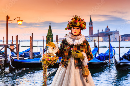 Venice, Italy. Carnival of Venice, beautiful mask at St. Mark's Square. © SCStock