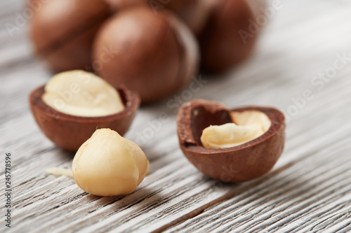 ripe macadamia nuts on a wooden table