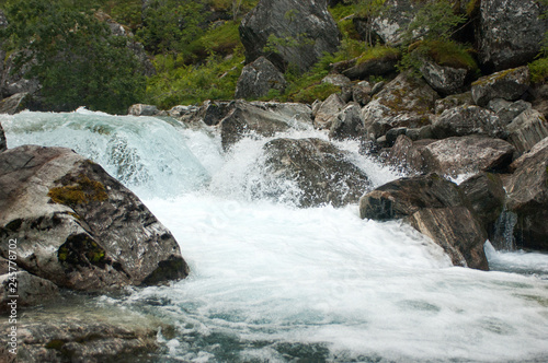 Mountain rapid river in Norway among boulders