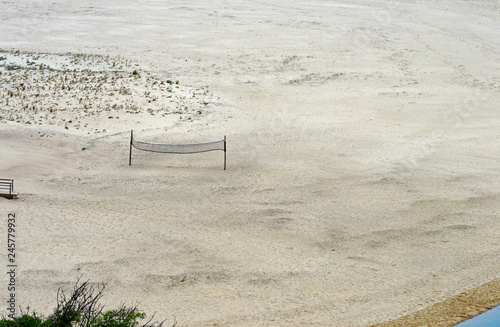 Volleyball net on the deserted beach of Praia de Odeceixe photo