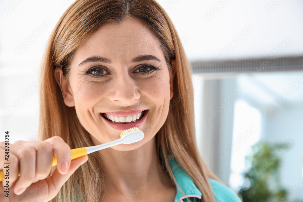 Portrait of woman with toothbrush in bathroom. Personal hygiene Portrait of woman with toothbrush in bathroom. Personal hygiene