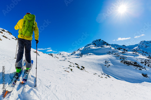 Skitouring with amazing view of swiss famous mountains in beautiful winter powder snow of Alps. photo