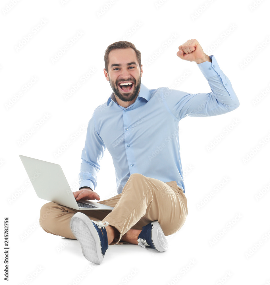 Emotional young man with laptop celebrating victory on white background Emotional young man with laptop celebrating victory on white background