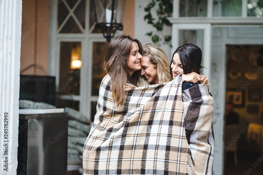 Three girlfriends on the veranda