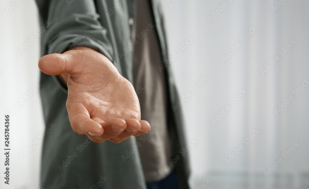 Man giving hand to somebody, closeup. Help and support concept - obrazy, fototapety, plakaty 
