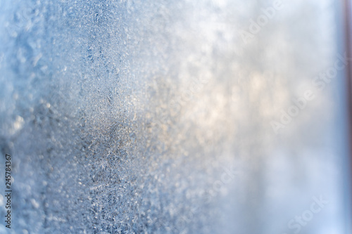 Closeup Photo of Details in Hoarfrost on Window on a Sunny Winter Day - Abstract Background