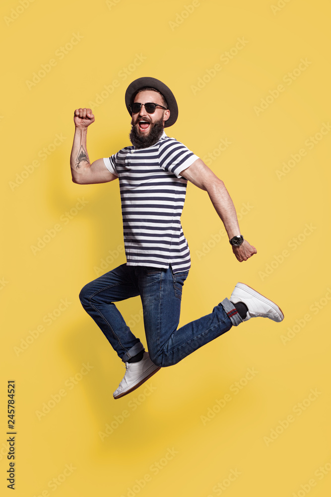 hipster man in hat and sunglasses jumping hipster man in hat and sunglasses jumping