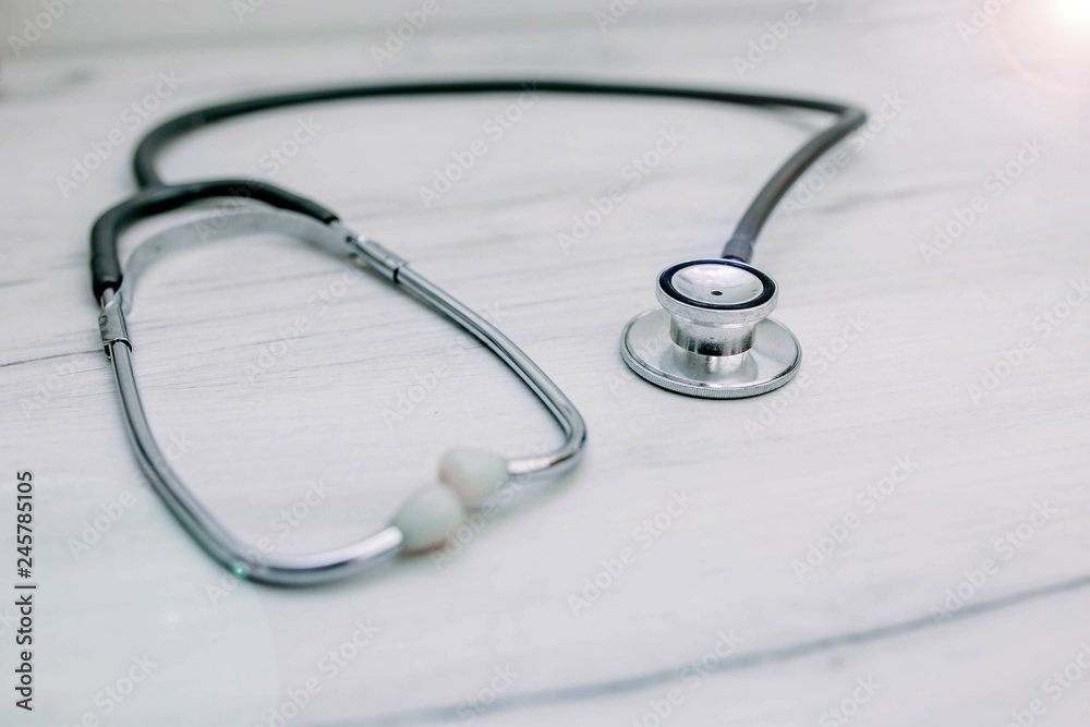  Medical stethoscope, phonendoscope on a wooden table. concept of medical care