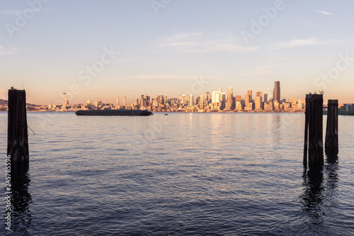 Elliott Bay, Seattle Bay, sunset light on skyscrapers of downtown in the background, Washington, USA