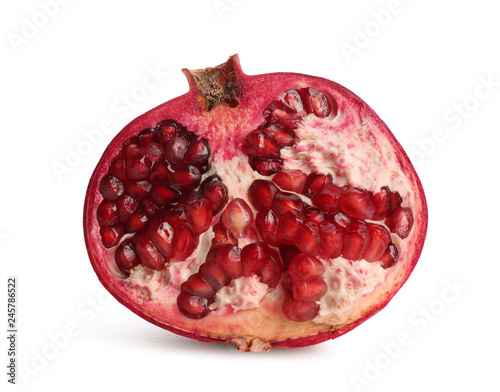 Half of ripe pomegranate on white background