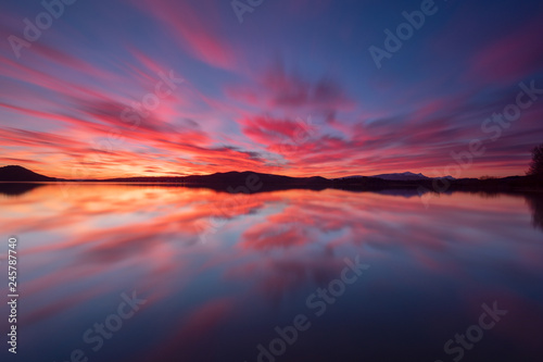 Colorful sunset reflected in a lake at Vitoria, Spain