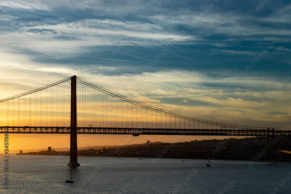 Bridge in Lisbon during sunset, Portugal skyline and cityscape on the Tagus River