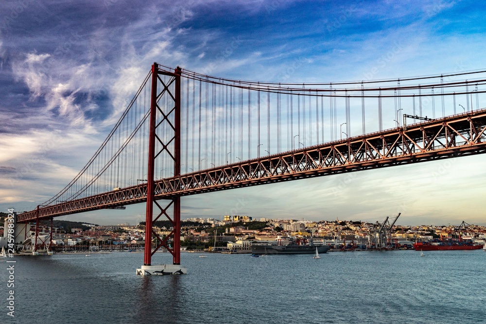 Bridge in Lisbon during sunset, Portugal skyline and cityscape on the Tagus River