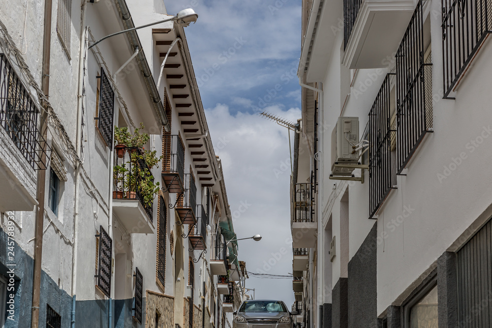 View of one street in the hilly town Montefrio, Granada