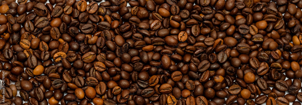 Naklejka premium coffee beans on the surface, the background of coffee beans.