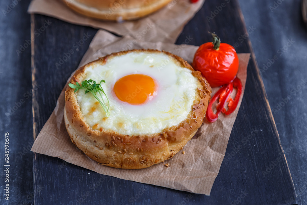 Cheese filled brioche with egg yolk and baked tomato Cheese filled brioche with egg yolk and baked tomato