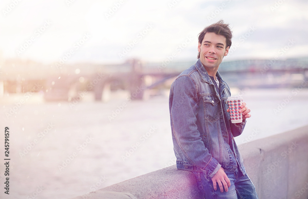 A young man walks in the park at lunch time. A man is on a walk in the city. A student in the park. A young man walks in the park at lunch time. A man is on a walk in the city. A student in the park.