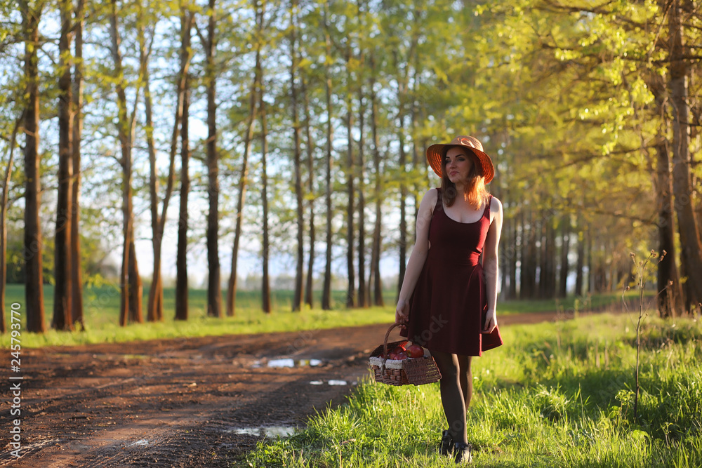 A girl in a hat on a walk in the park. A girl with a basket walks in the spring. A girl is walking along the road at sunset. A girl in a hat on a walk in the park. A girl with a basket walks in the spring. A girl is walking along the road at sunset.