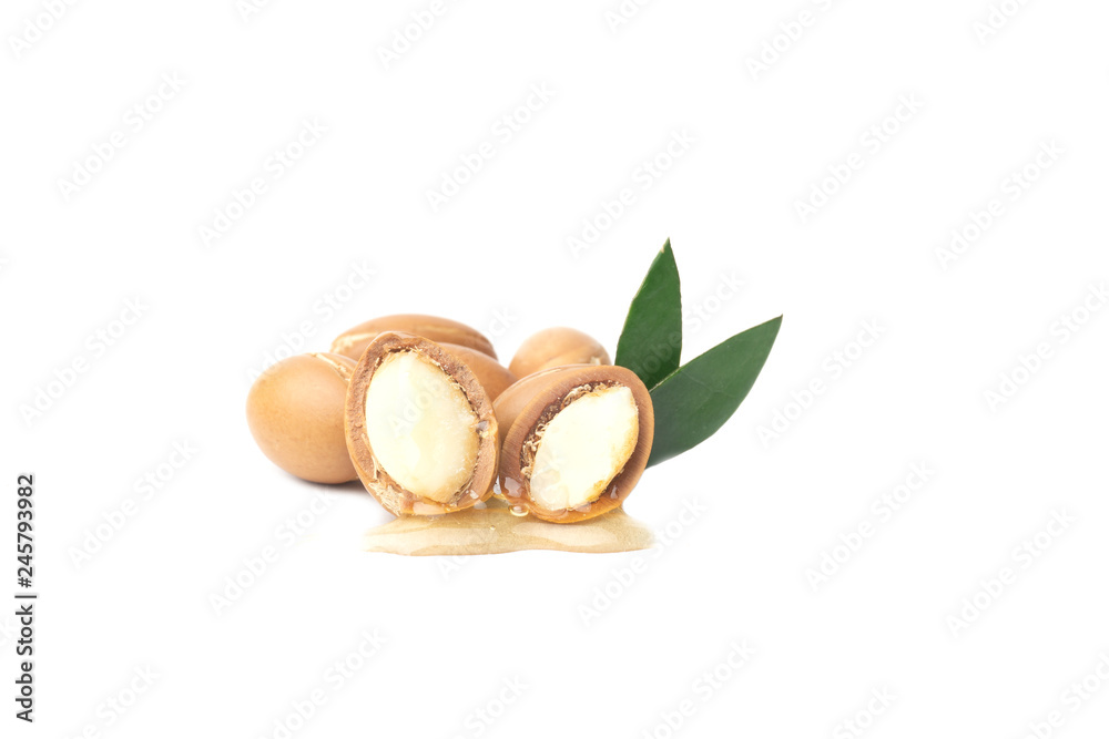 ARGAN SEEDS isolated on a white background. Argan oil and argan nuts concept ARGAN SEEDS isolated on a white background. Argan oil and argan nuts concept