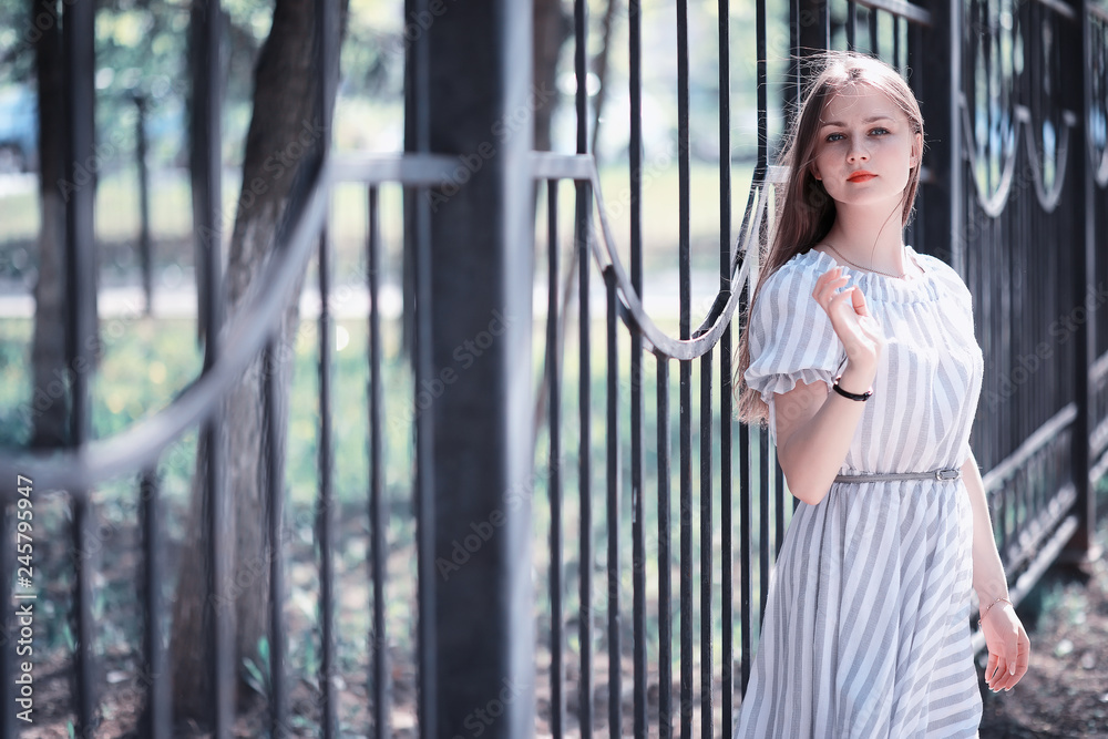 A girl in a spring green park