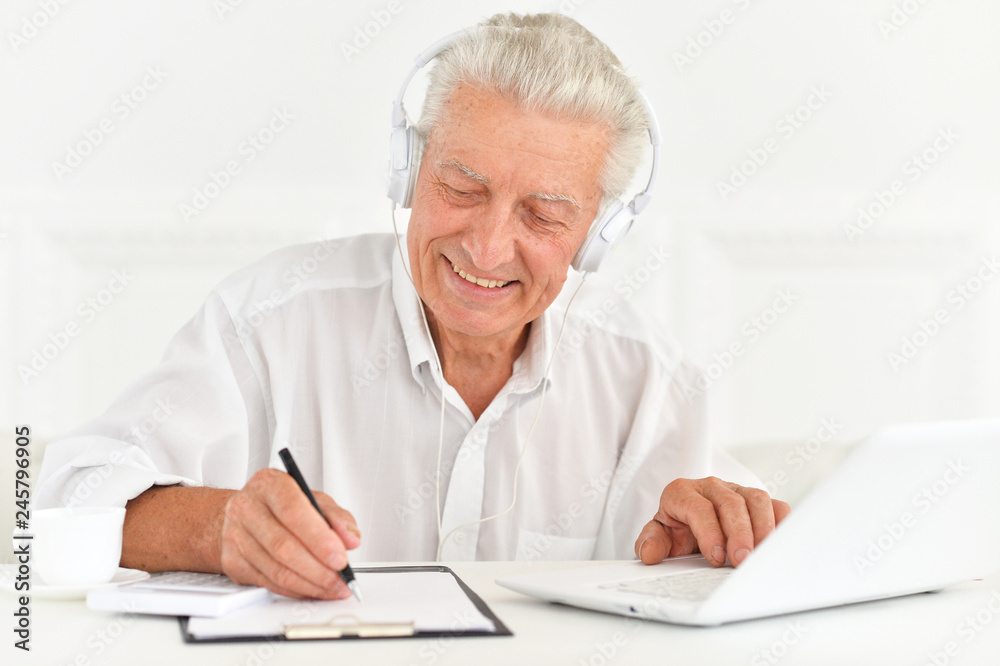 confident senior businessman working in the office confident senior businessman working in the office