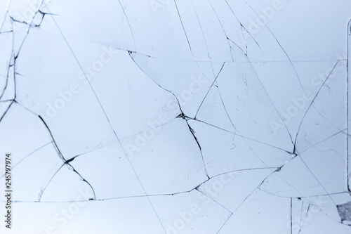 Broken glass on blue background, object background design texture