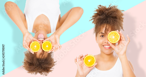 Summer time holidays. Beautiful young african american women with orange fruit food collage isolated . Afro girl and diet concept. Copy space. Mock up. Skin care, Afro curly hair style