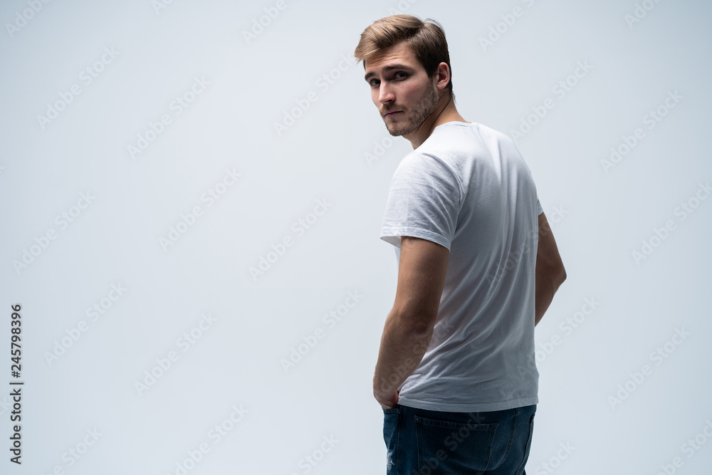 Handsome young guy posing in studio - isolated Handsome young guy posing in studio - isolated