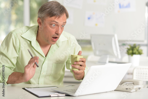 Man working with laptop in the office