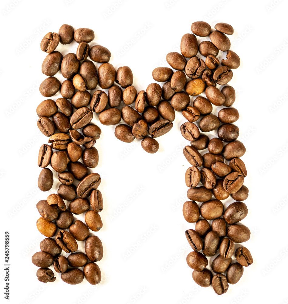 M letter made from coffee beans isolated on white background M letter made from coffee beans isolated on white background