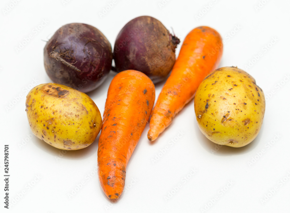 potatoes, beets and carrots on a white background potatoes, beets and carrots on a white background