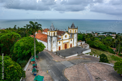 The architecture of the historic city of Olinda in Pernambuco, Brazil showcasing the Se Church dated from the 17th century in Baroque style at sunset.