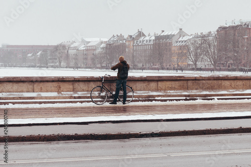 Photography Man on the bridge at Sortedamsøen, Copenhagen, Denmark