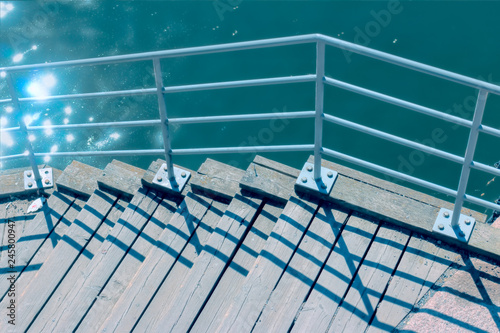 Photography wooden dock with railing by the water in stockholm