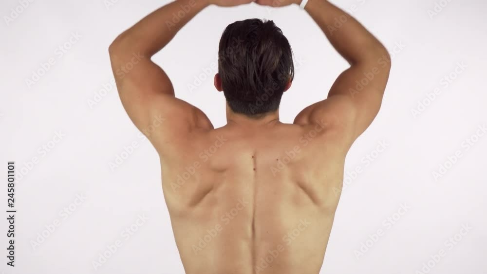 Rearview shot of a muscular shirtless man flexing his back and arms muscles. Athletic sportsman showing off his ripped strong body isolated. Determination, bodybuilding concept Rearview shot of a muscular shirtless man flexing his back and arms muscles. Athletic sportsman showing off his ripped strong body isolated. Determination, bodybuilding concept