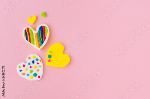 Plasticine hearts on pink background with copy space