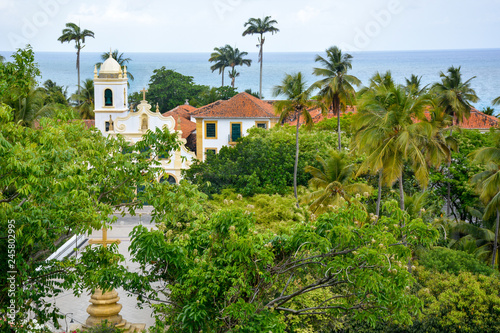 Aerial view of the city of Olinda in Pernambuco, Brazil with its exuberant Atlantic Forest and historic buildings in Baroque style dated from the 17th century on a sunny summer day. © zoroastofelix