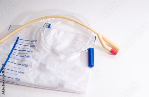 catheter with urinal bag are on a white background, dropper