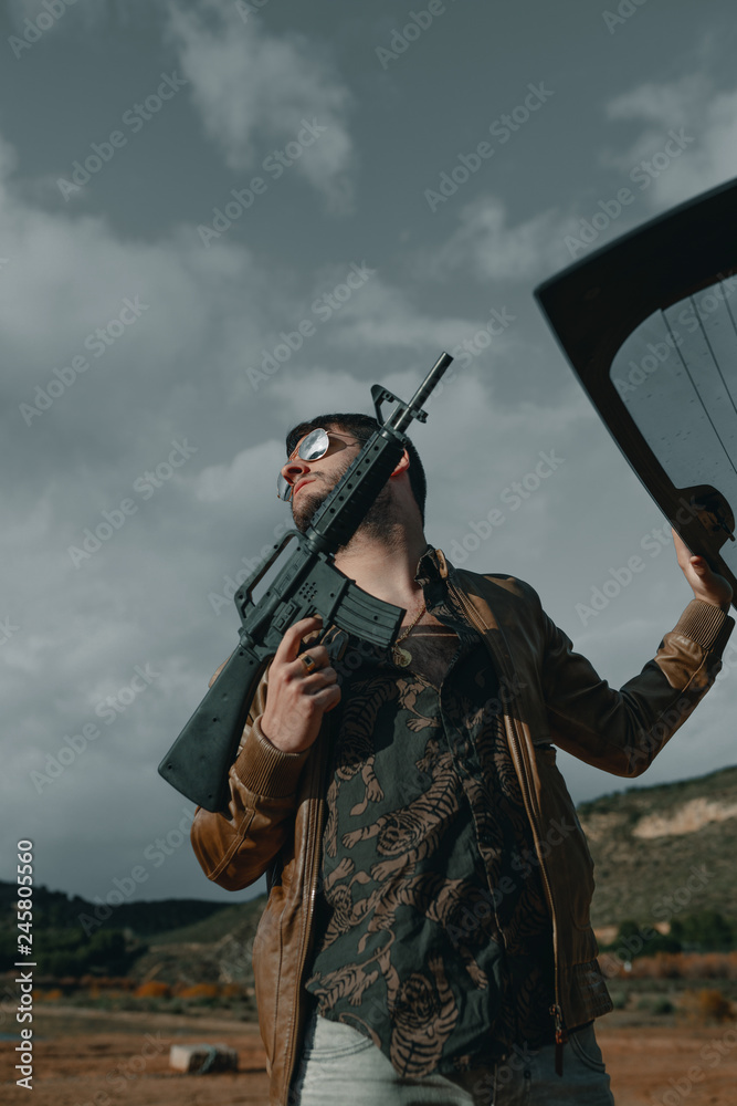 Man with a gun. Man with assault rifle. Man with machine gun. Stock ...