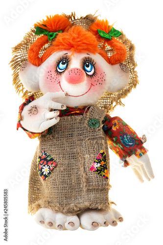 Smiling rag doll with red braids, four fingers isolated on white background. Traditional folklore toy of Karelia