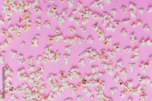 Popcorn pattern on pink background. Top view