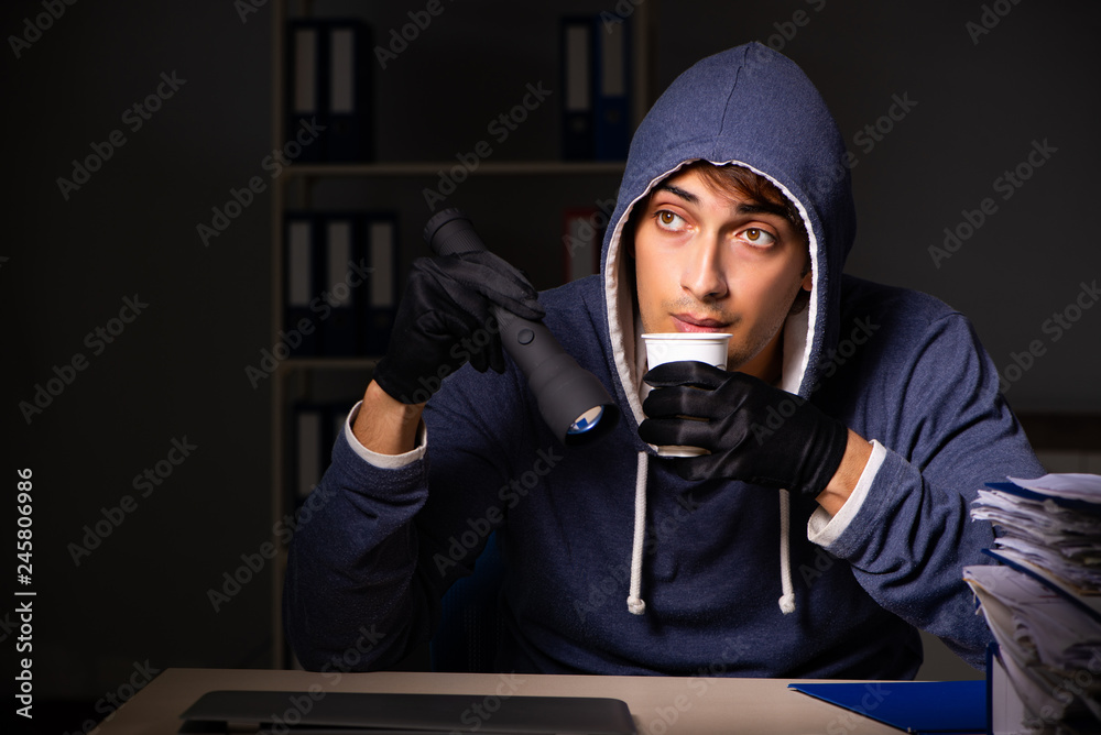 Thief trying to steal personal data in identity theft concept Thief trying to steal personal data in identity theft concept