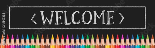 'Welcome' text with color pancils on black board. Panoramic illustration.