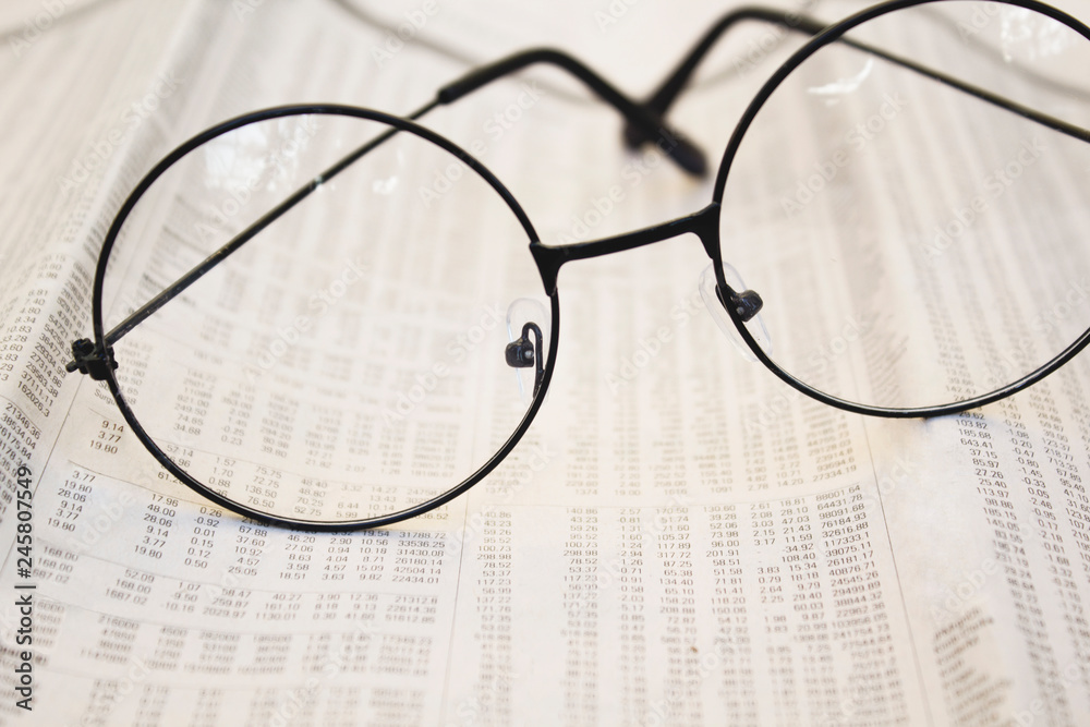 Eyeglasses on accounting papers. Close up. Eyeglasses on accounting papers. Close up.