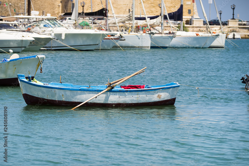 One little boat in the port of Bari, Apulia, Italy