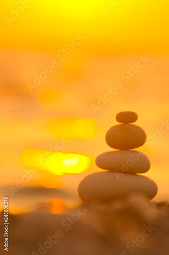 stack of zen stones on pebble beach