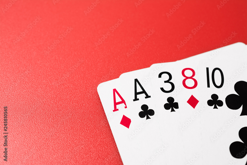 Poker hands playing cards two aces on pair on a red background