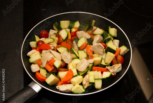 vegetables with meat on a griddle, close-up, healthy food