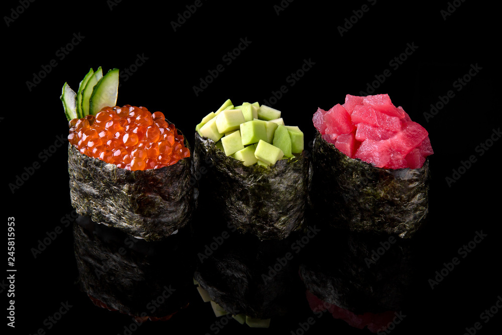 Gunkan Maki Sushi of fish salmon, scallop, perch, eel, shrimp and