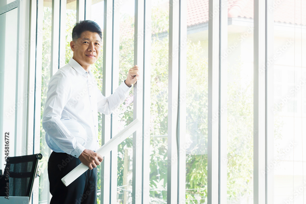 Business man looking project next the windows. Business man looking project next the windows.